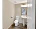 Simple, clean bathroom with pedestal sink and toilet at 1054 Valley Rock Dr, Lithonia, GA 30058