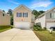 Two-story brick home with attached garage at 1054 Valley Rock Dr, Lithonia, GA 30058