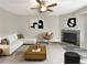 Spacious living room featuring a cozy fireplace and ample natural light at 1054 Valley Rock Dr, Lithonia, GA 30058