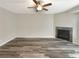 Bright living room with wood-look floors and a corner fireplace at 1054 Valley Rock Dr, Lithonia, GA 30058