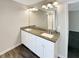 Double vanity bathroom with granite countertop at 1054 Valley Rock Dr, Lithonia, GA 30058