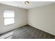 Well-lit bedroom featuring neutral walls and carpet at 1054 Valley Rock Dr, Lithonia, GA 30058