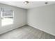 Bright bedroom with neutral walls and carpet flooring at 1054 Valley Rock Dr, Lithonia, GA 30058