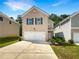 Brick two-story home with a two-car garage at 1054 Valley Rock Dr, Lithonia, GA 30058