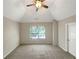 Spacious main bedroom with vaulted ceilings and neutral tones at 1054 Valley Rock Dr, Lithonia, GA 30058
