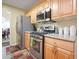 Kitchen with stainless steel appliances and light wood cabinets at 1215 Wandering Vine Ct, Mableton, GA 30126