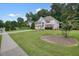 Two-story house with red shutters and a driveway at 1215 Wandering Vine Ct, Mableton, GA 30126