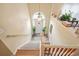 Bright entryway with staircase, chandelier, and wood floors at 1215 Wandering Vine Ct, Mableton, GA 30126