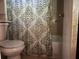 Bathroom with shower/tub combo and patterned shower curtain at 3593 Riverchase Dr, Decatur, GA 30034