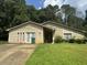 House exterior with light yellow siding and driveway at 3593 Riverchase Dr, Decatur, GA 30034