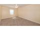 Simple bedroom with ceiling fan and window at 1430 Springside Ct, Snellville, GA 30078