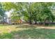 Large backyard with mature trees and playset at 1430 Springside Ct, Snellville, GA 30078