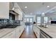 Modern kitchen with stainless steel appliances and granite countertops at 1988 Skybrooke Ct, Hoschton, GA 30548