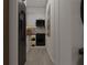 Modern galley kitchen with black appliances and white cabinets at 6305 Shannon Parkway # 206, Union City, GA 30291