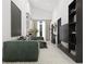 Spacious living room featuring a green sofa and large TV at 6305 Shannon Parkway # 206, Union City, GA 30291