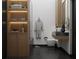 Spa-like bathroom with floating vanity and wooden shelving at 6305 Shannon Parkway # 206, Union City, GA 30291