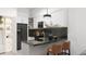 Modern kitchen with sleek cabinetry, dark countertops, and stainless steel appliances at 6305 Shannon Parkway # 206, Union City, GA 30291