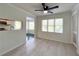 Dining area with light walls, wood-look floors, and a ceiling fan at 14 Saint Claire Ne Ln, Atlanta, GA 30324