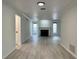Living room with fireplace, light walls, and wood-look floors at 14 Saint Claire Ne Ln, Atlanta, GA 30324