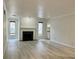 Bright living room with light walls, wood-look floors and a fireplace at 14 Saint Claire Ne Ln, Atlanta, GA 30324