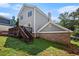 Gray house with a wooden deck and brick basement at 131 Bowen Sw Cir, Atlanta, GA 30315