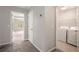 Hallway with laundry room and access to bedrooms at 131 Bowen Sw Cir, Atlanta, GA 30315