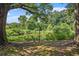 Serene pond surrounded by lush greenery and mature trees at 131 Bowen Sw Cir, Atlanta, GA 30315