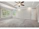 Spacious main bedroom with ceiling fan and large windows at 131 Bowen Sw Cir, Atlanta, GA 30315