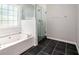 Bathroom with soaking tub and glass shower at 131 Bowen Sw Cir, Atlanta, GA 30315