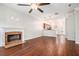 Spacious living room with hardwood floors, fireplace, and access to kitchen at 131 Bowen Sw Cir, Atlanta, GA 30315