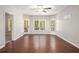 Living room with hardwood floors and multiple windows at 131 Bowen Sw Cir, Atlanta, GA 30315