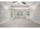 Main bedroom with door to deck and large windows at 131 Bowen Sw Cir, Atlanta, GA 30315