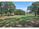 Spacious green lawn with mature trees and homes in the background at 131 Bowen Sw Cir, Atlanta, GA 30315