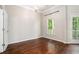 Bright bedroom with hardwood floors and access to a balcony at 131 Bowen Sw Cir, Atlanta, GA 30315