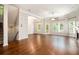 Spacious living room with hardwood floors, large windows, and access to a deck at 131 Bowen Sw Cir, Atlanta, GA 30315