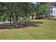 Serene community greenspace featuring a park bench under shady trees at 131 Bowen Sw Cir, Atlanta, GA 30315