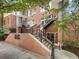 Brick townhouse with stairs and black railings at 745 Fountainhead Ne Ln # 113, Atlanta, GA 30324
