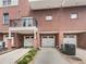 Brick townhome building with attached garages and private balconies at 745 Fountainhead Ne Ln # 113, Atlanta, GA 30324