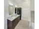Double vanity bathroom with granite countertops and tile flooring at 745 Fountainhead Ne Ln # 113, Atlanta, GA 30324