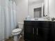 Clean bathroom with shower and dark brown vanity at 2314 Rolling Trl, Lithonia, GA 30058