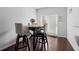 Small dining area with table and chairs near door at 2314 Rolling Trl, Lithonia, GA 30058
