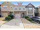 Modern townhome with two-car garage and landscaping at 2314 Rolling Trl, Lithonia, GA 30058