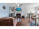 Open living room and kitchen with fireplace and hardwood floors at 2314 Rolling Trl, Lithonia, GA 30058