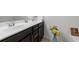 Double vanity bathroom with dark brown cabinets and tile floors at 2314 Rolling Trl, Lithonia, GA 30058