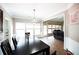 Open concept dining room with hardwood floors and view of living room at 2623 Silver Dust Dr, Buford, GA 30519