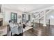 Elegant living room with hardwood floors, fireplace, and French doors at 6515 Wesley Hughes Rd, Cumming, GA 30040