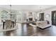 Bright dining room with hardwood floors and large windows at 6515 Wesley Hughes Rd, Cumming, GA 30040