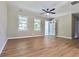 Spacious living room with hardwood flooring and ceiling fan at 6733 Walker Rd, Riverdale, GA 30296