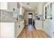 Renovated kitchen with granite counters and white cabinets at 6733 Walker Rd, Riverdale, GA 30296
