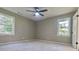 Spacious bedroom with neutral walls and carpet flooring at 6733 Walker Rd, Riverdale, GA 30296